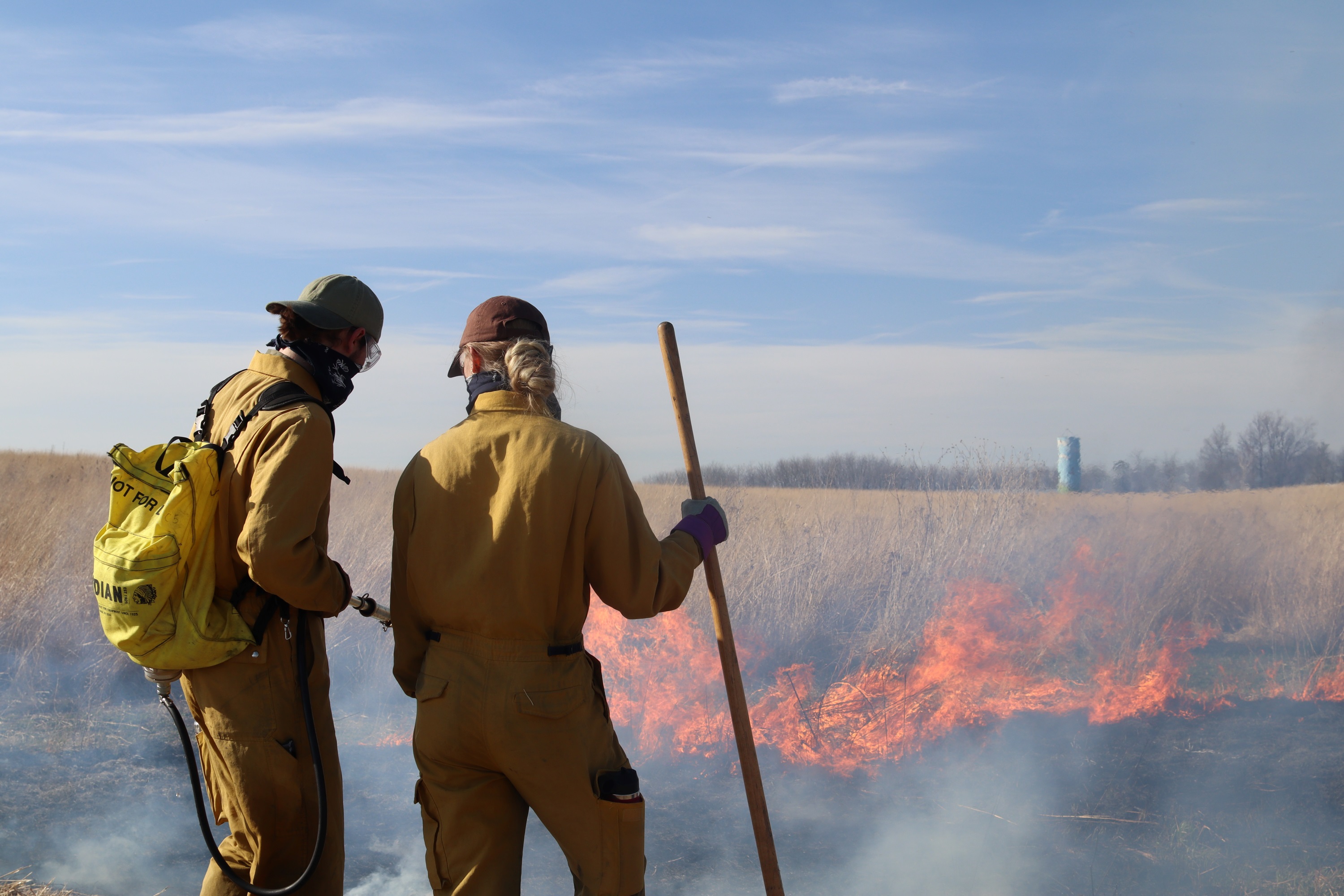 Students participate in prescribed burn at Irvine Prairie. 