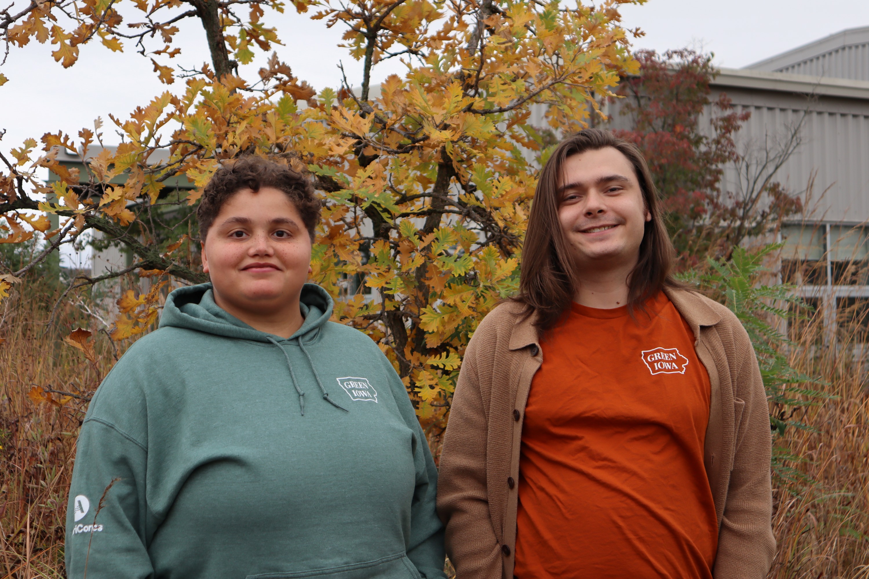 Ethan and Ella in front of an oak changing colors in the fall. 