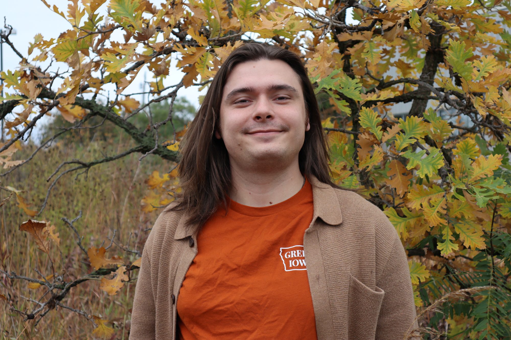 Ethan in front of oak tree in the fall