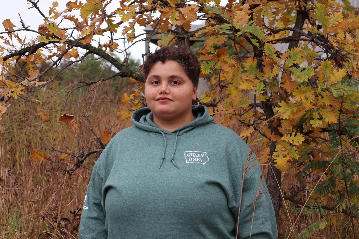Ella in front of oak tree during fall