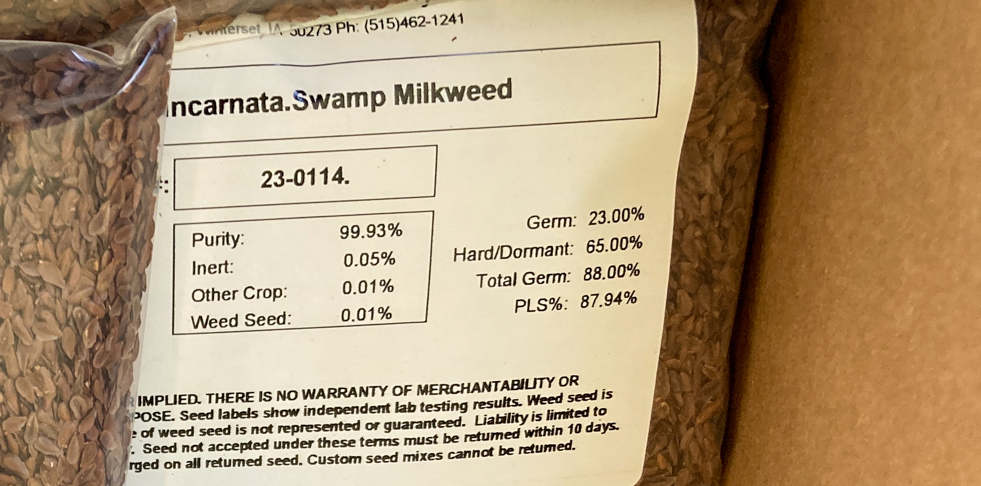 Closeup of a seed label visible in a transparent bag of seeds.