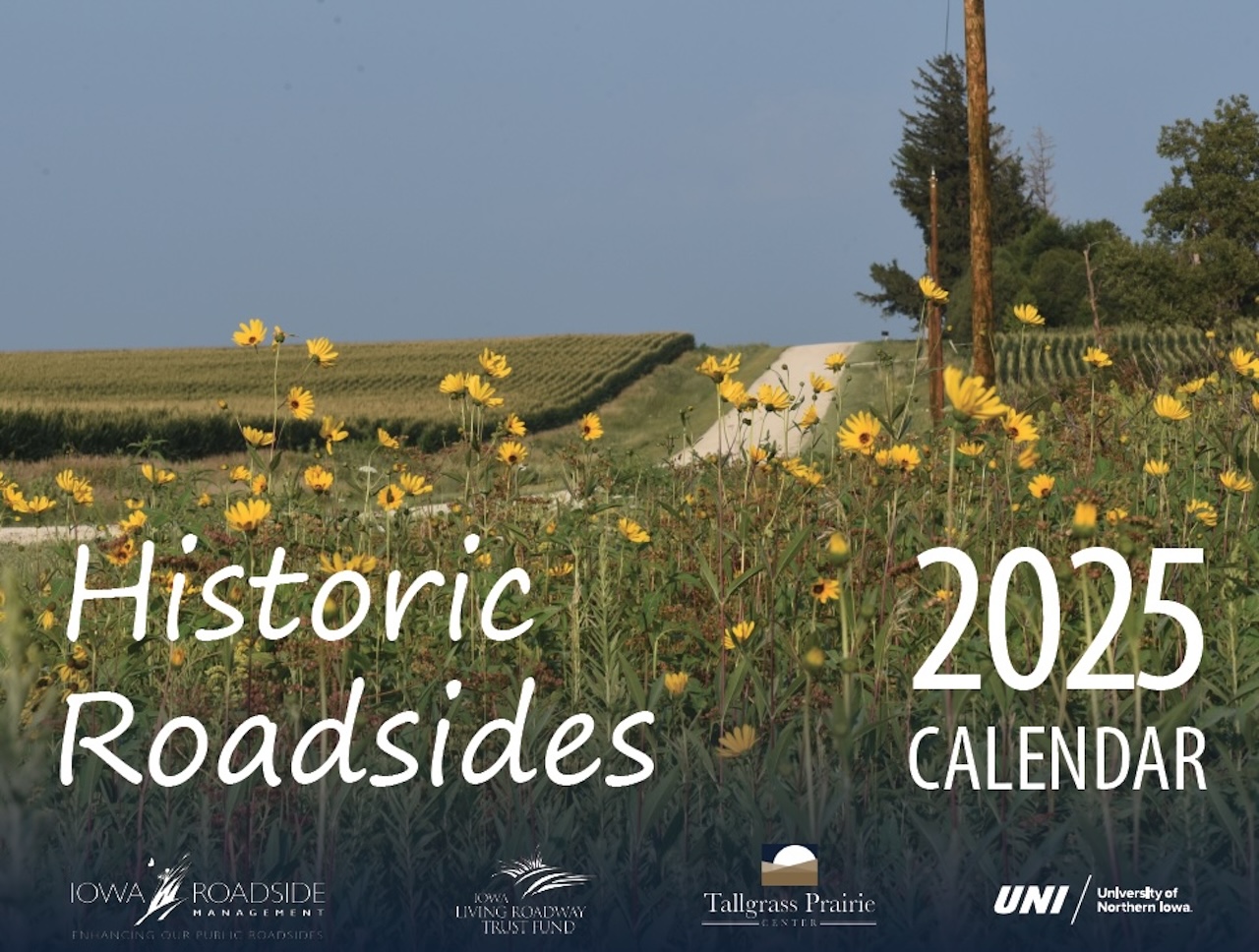 Cover photo of calendar with flowering plants along rural gravel road