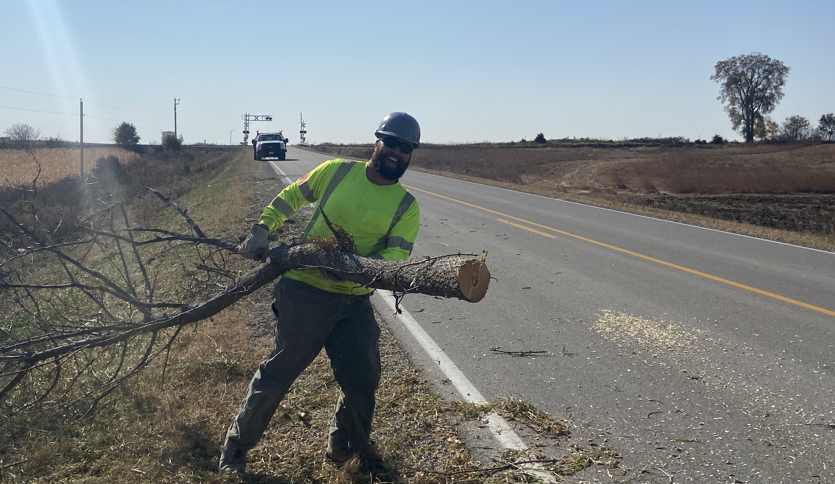 Photo of roadside manager removing brush